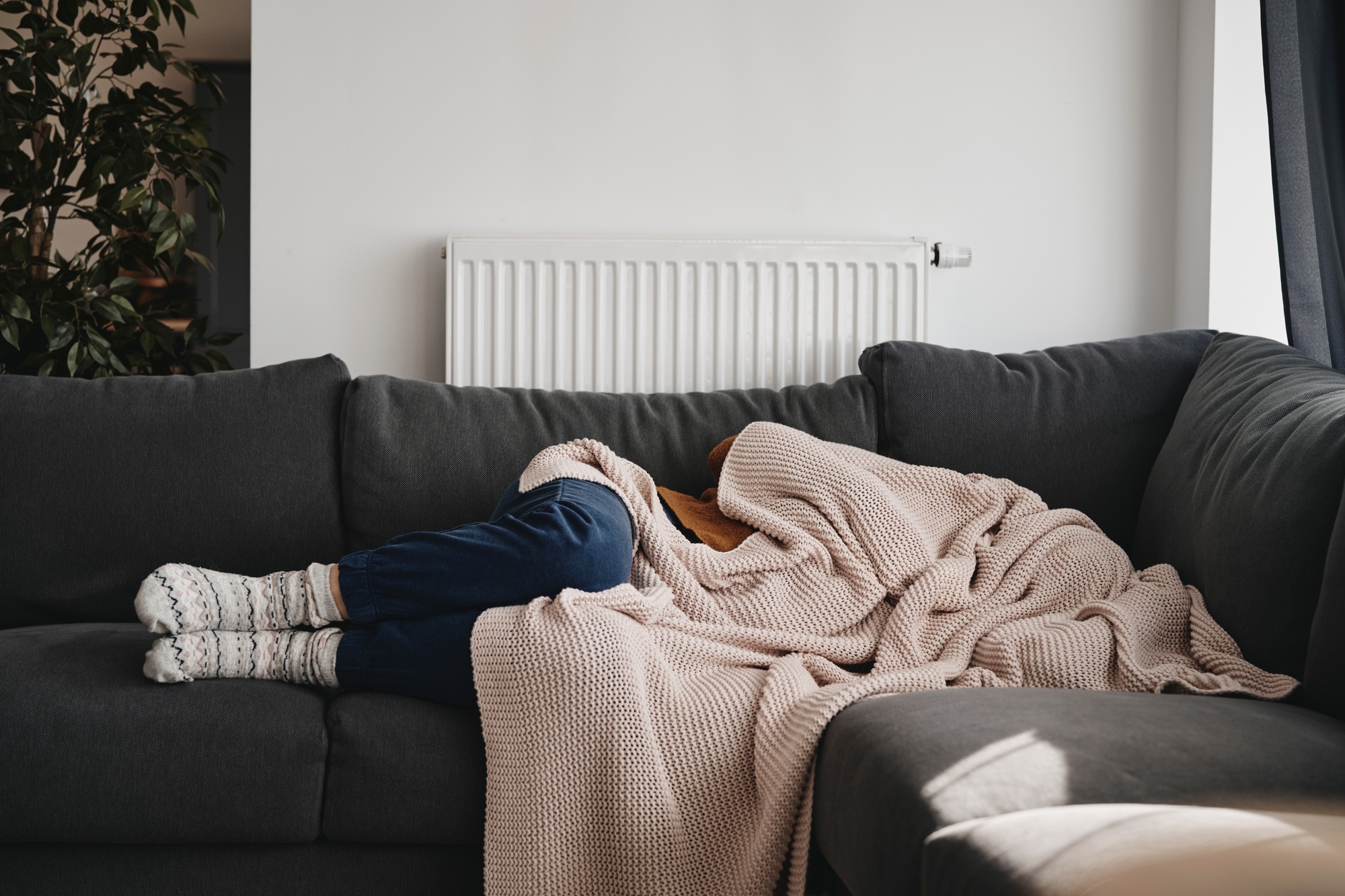 Woman sleeping under the blanket