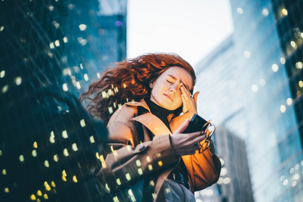 Stressed business woman in the night city.